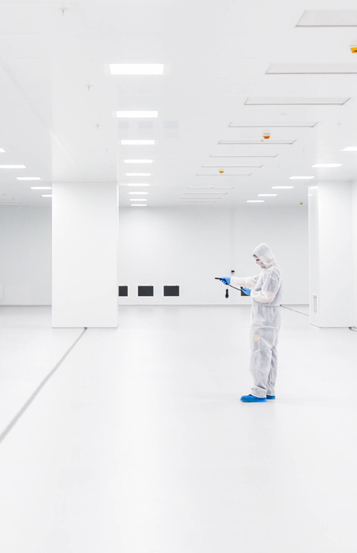 Empty cleanroom interior with HEPA filter ceiling panels, seamless flooring and portable air handling unit