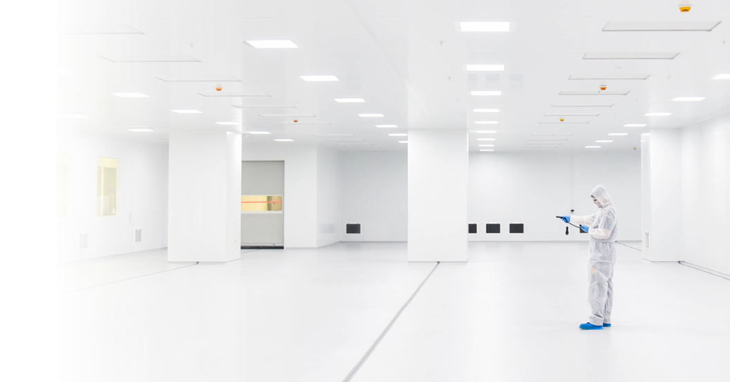 Empty cleanroom interior with HEPA filter ceiling panels, seamless flooring and portable air handling unit